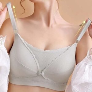 Luxury seamless nursing bra shown on a model's shoulders with adjustable straps.