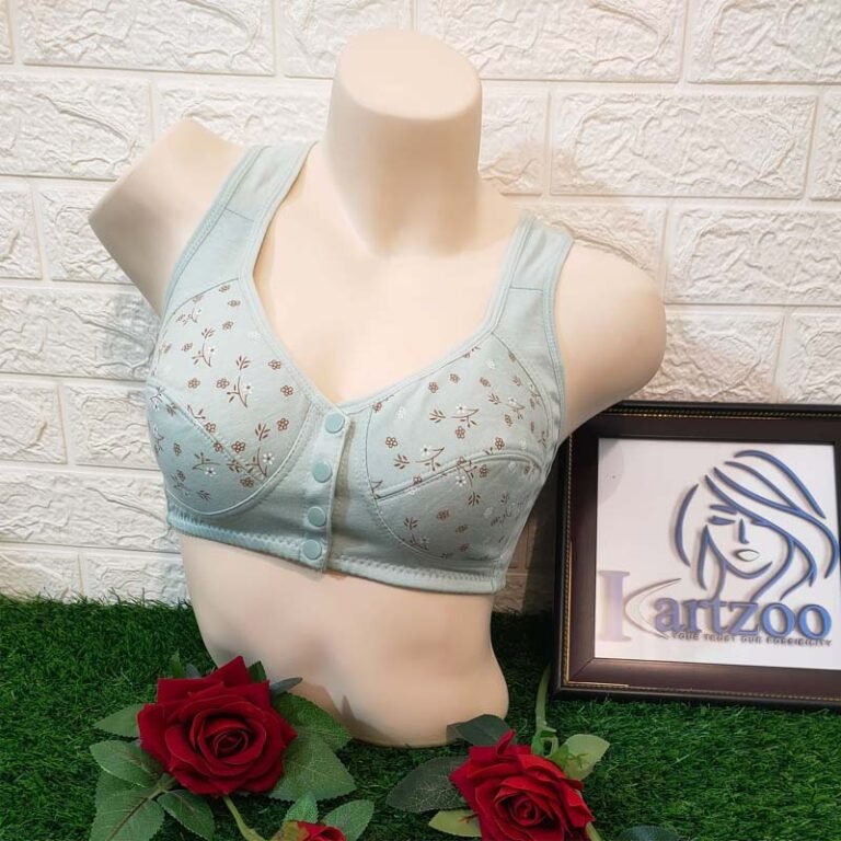 A light blue bra displayed on a mannequin against a textured wall with a framed logo nearby.
