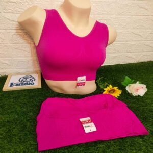 Magenta Comfort Plus Bra displayed on a mannequin with additional matching garment on a green grass-like surface.